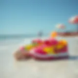 Colorful children's pool shoes on a sunny beach