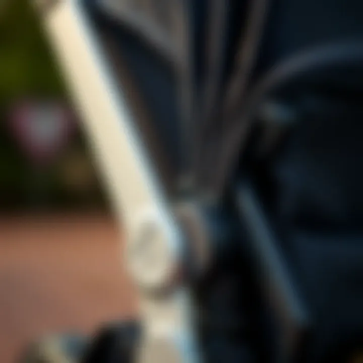 A close-up of the features of a foldable stroller highlighting its design.