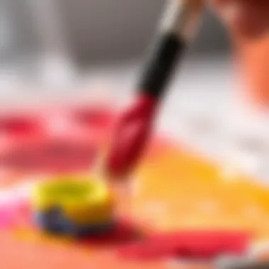 Close-up of a brush dipped in vibrant watercolor
